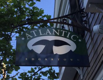 Atlantic Logo Sign of Atlantic Edgartown handing from a building