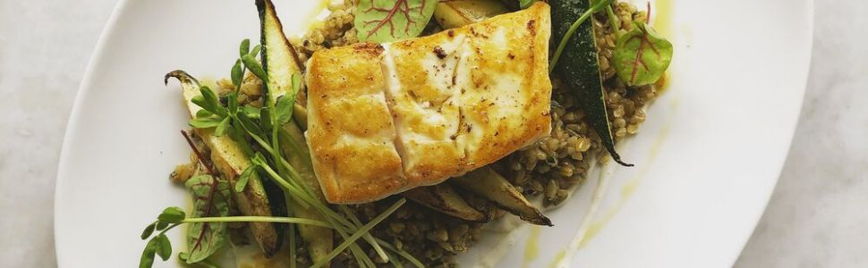 The Covington Food example plate of seafood on some greens